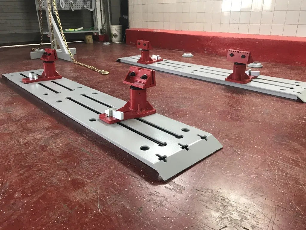 Auto Body Frame Machine Floor Rack System Complete 10 TON Puller FREE TOOLS 10 TON frame pulling machine in an auto body shop setting.