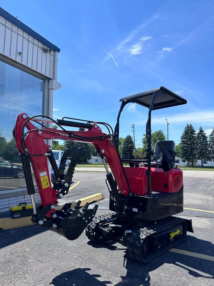 Compact size comparison of the mini excavator in a workshop
