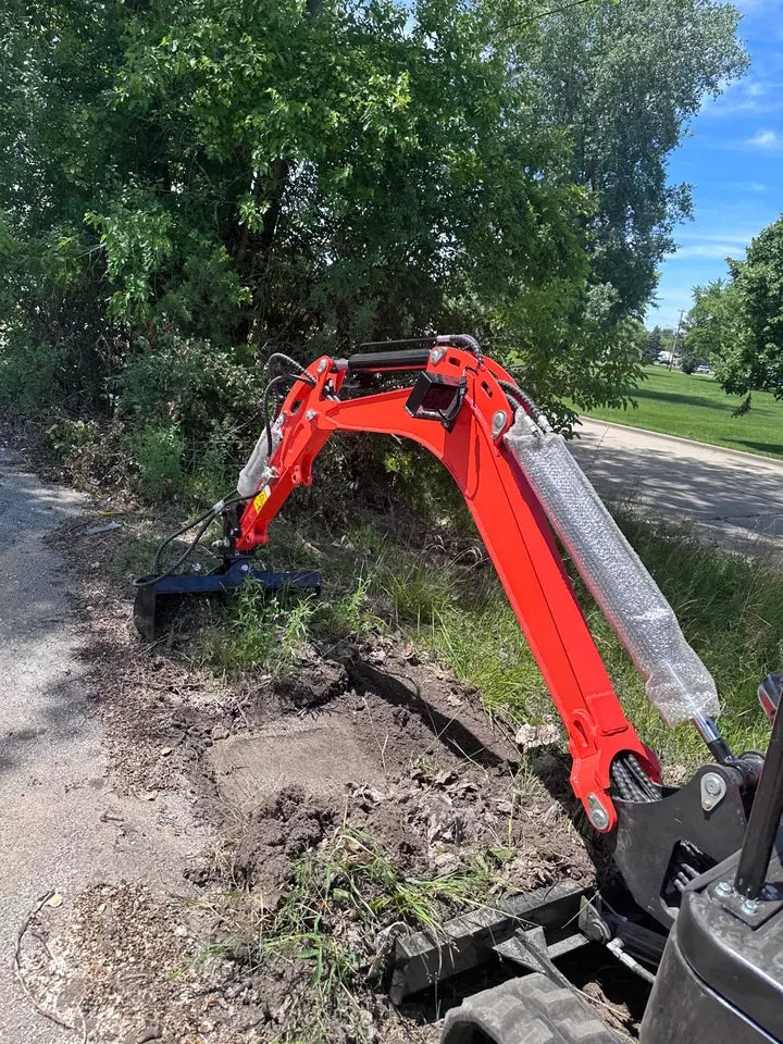 Excavator operating with hydraulic tilt bucket attachment
