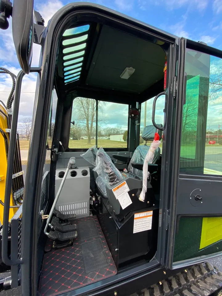 Excavator showing hydraulic thumb and bucket in use