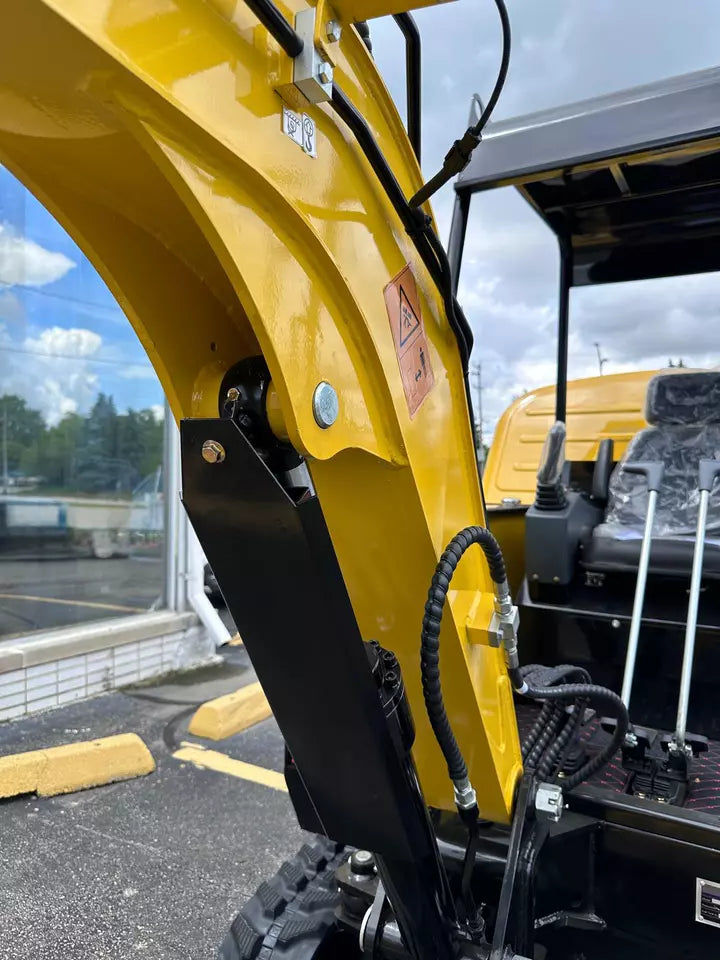 Front view of the mini excavator highlighting its robust design.
