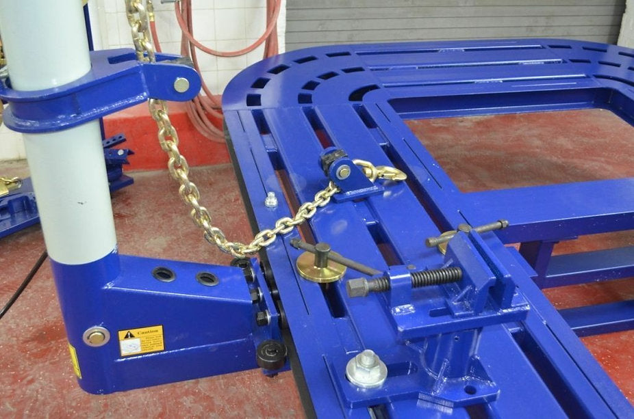  Heavy-duty frame machine bed with multiple tie-down points for full-frame vehicles.