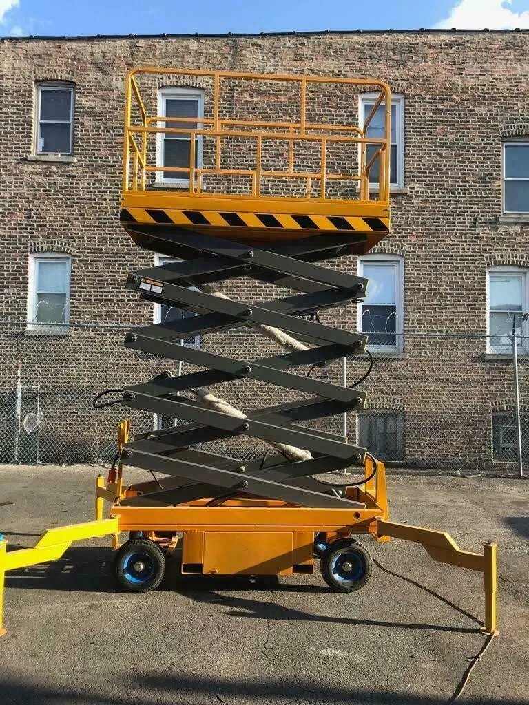 High scissor lift in action
