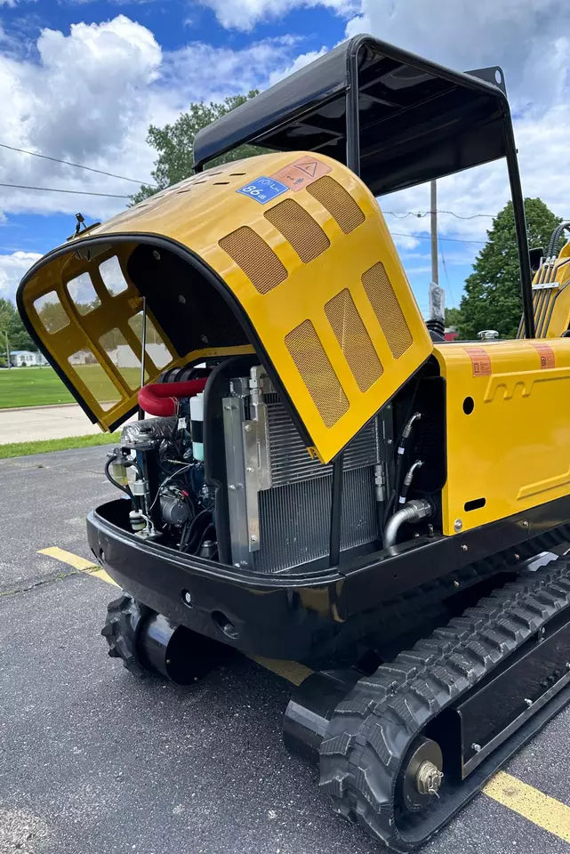 In-stock sign next to the new mini excavator for sale.
