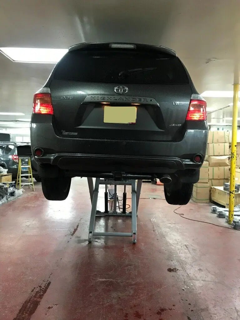 Mechanic Lift in Action - Lifting a vehicle.
