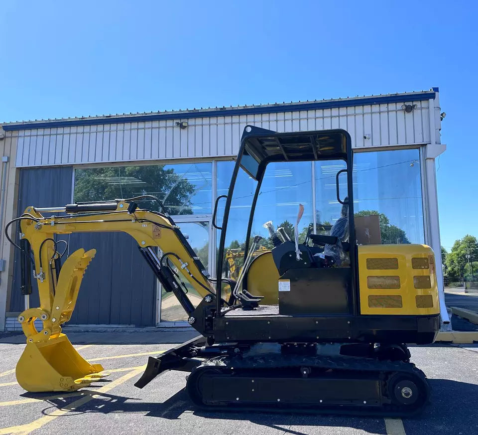 Mini excavator being loaded onto a trailer for transportation.
