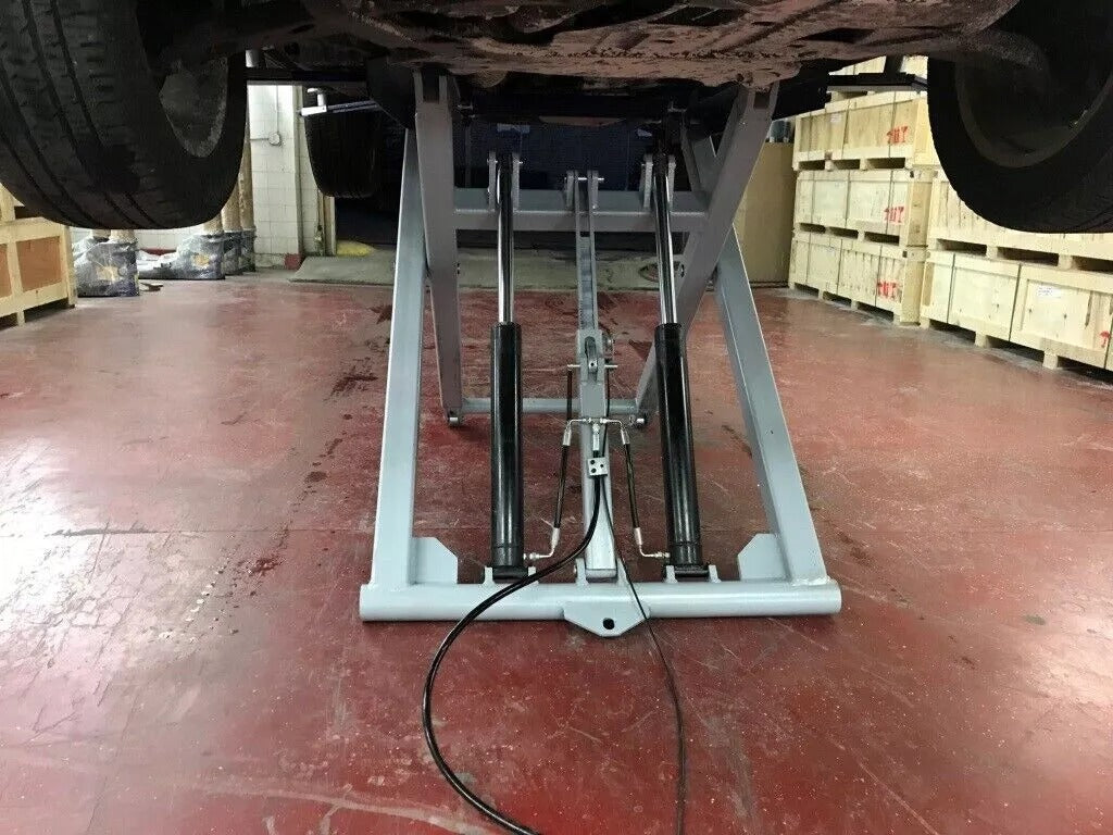 Scissor lift in a small garage.