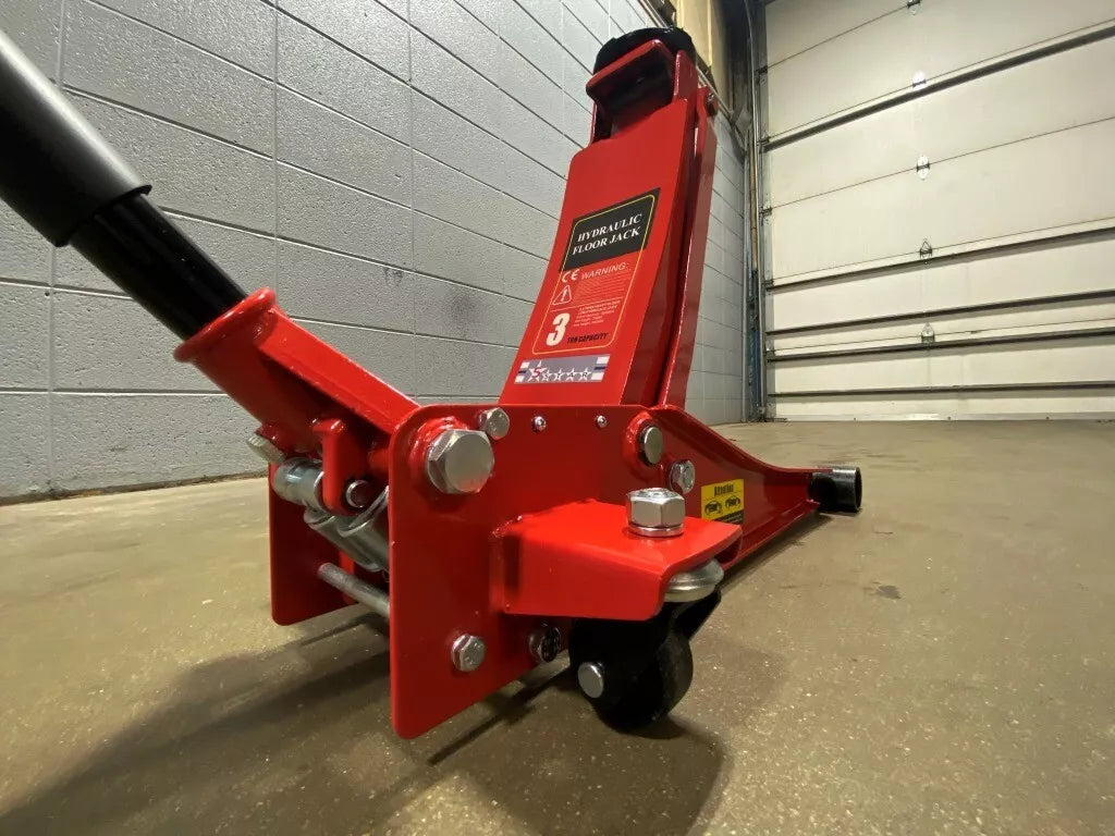 Ultra-low profile 3 Ton Floor Jack reaching under a sports car