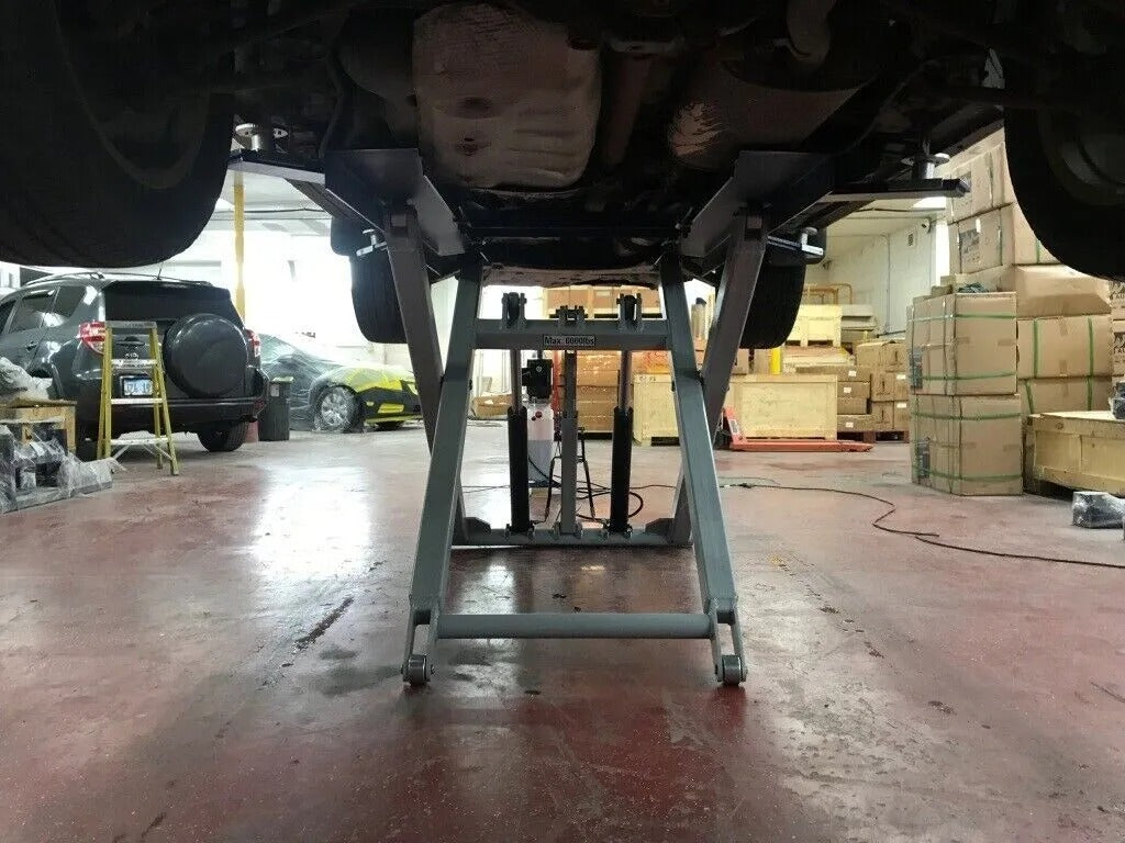 Vehicle on Lift - Car elevated for service.
